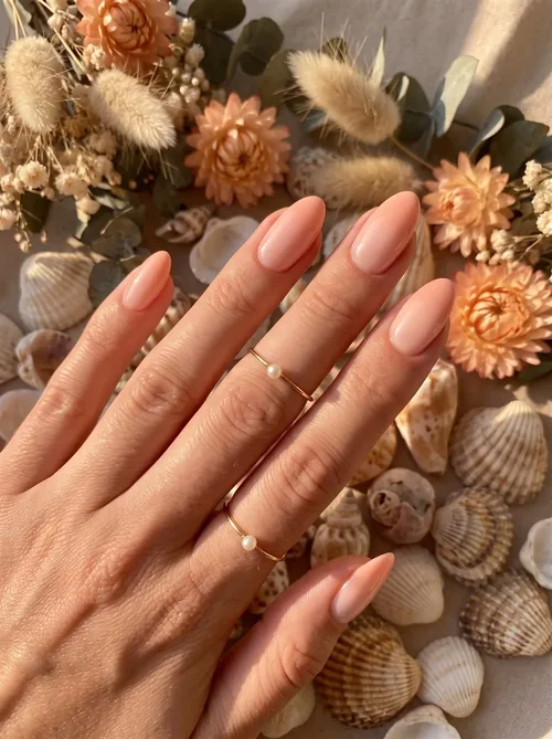 Inspiration baby boomer pêche et corail sur ongles amande longs